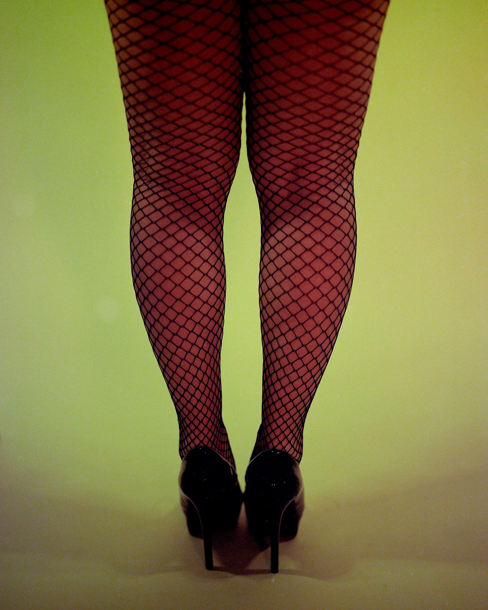 image of the artists legs in fishnets